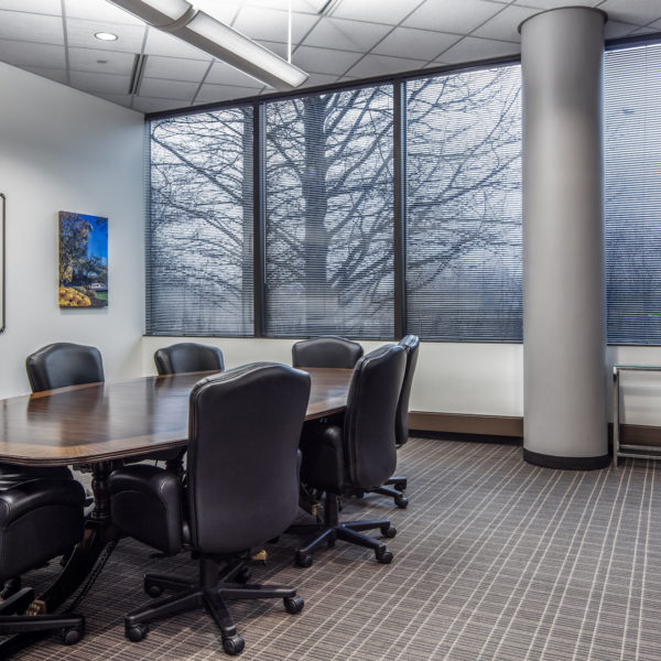 Conference room chairs, table and windows inside Old Orchard Towers in Skokie, IL.
